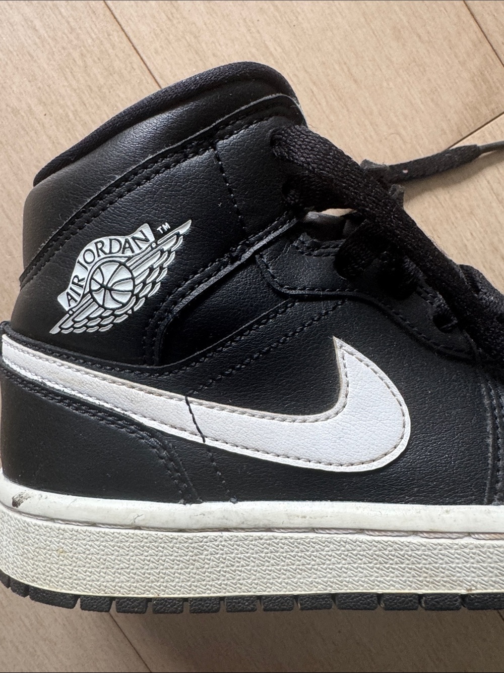 Air Jordan 1 Retro Mid Black and White Panda Sneakers